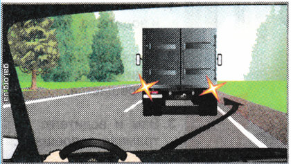 Виконати об’їзд вантажного автомобіля, що зупинився, у напрямку, показаному стрілкою: