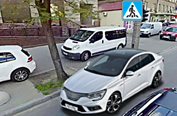 Чи дозволено водієві сірого автомобіля зупинитись у цьому місці?